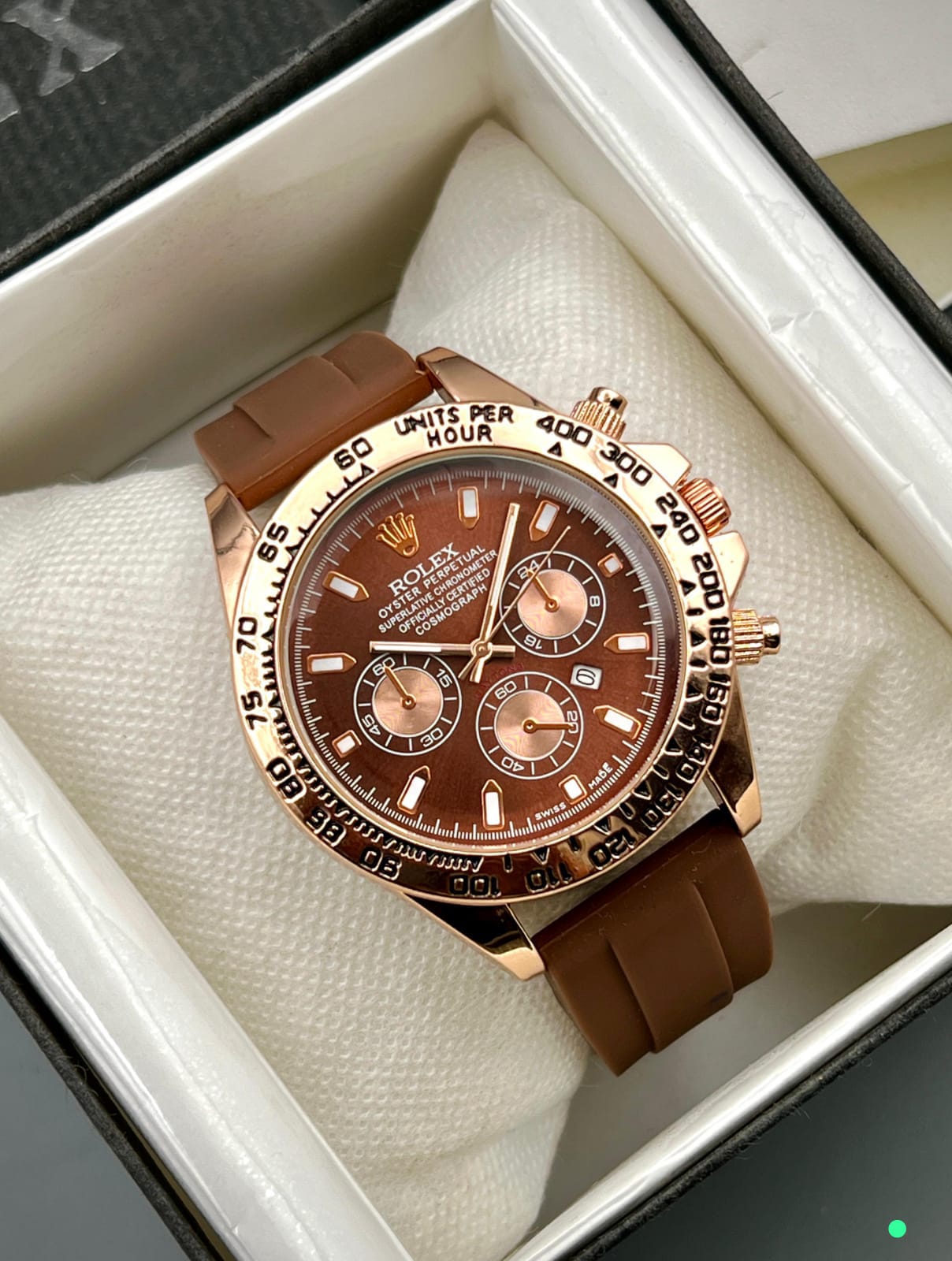 ROLEX DAYTONA Gent's Collection. Crafted with a sturdy rubber strap and brass case