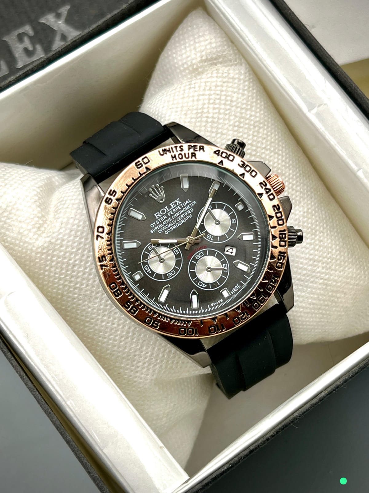 ROLEX DAYTONA Gent's Collection. Crafted with a sturdy rubber strap and brass case